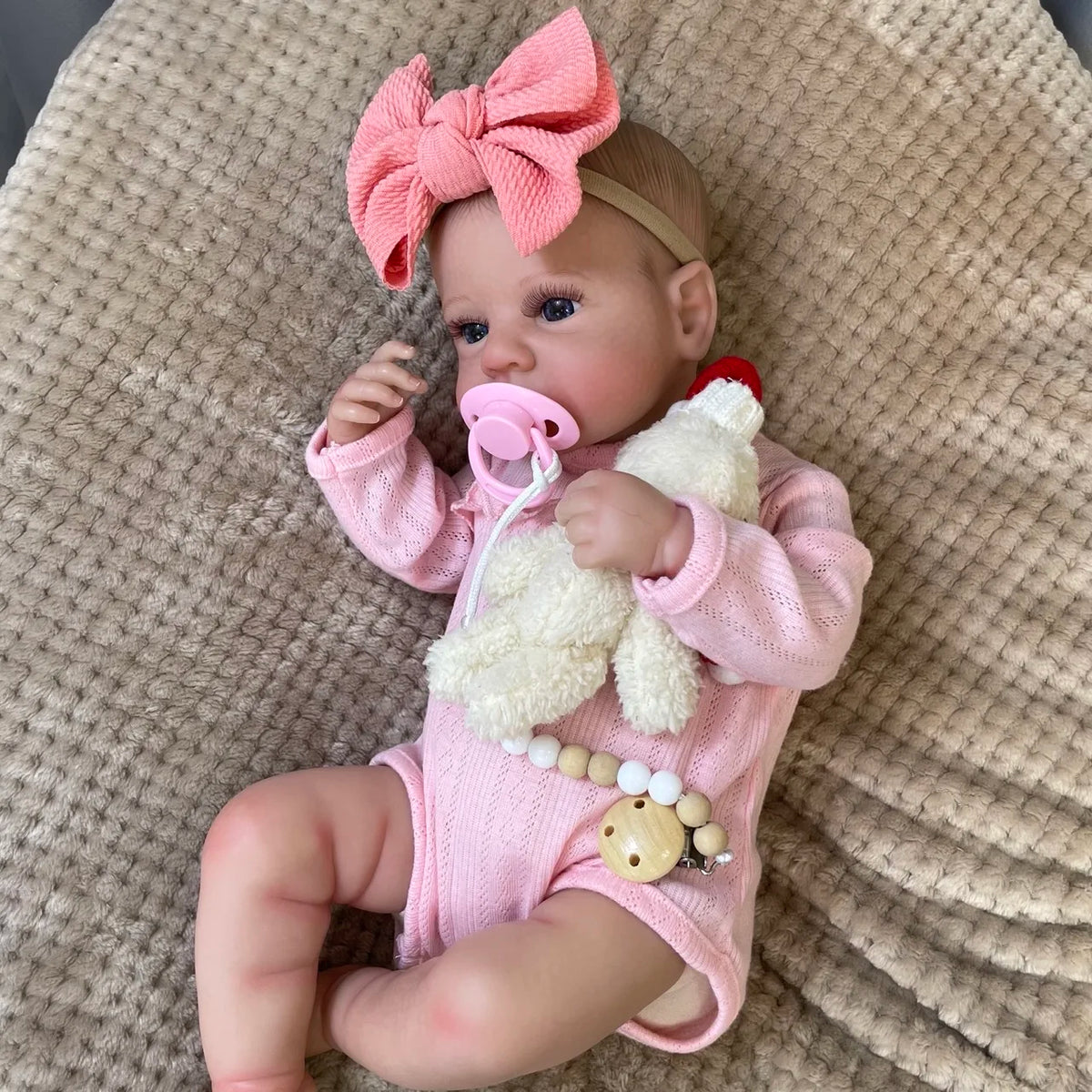 Daphne with a pink pacifier