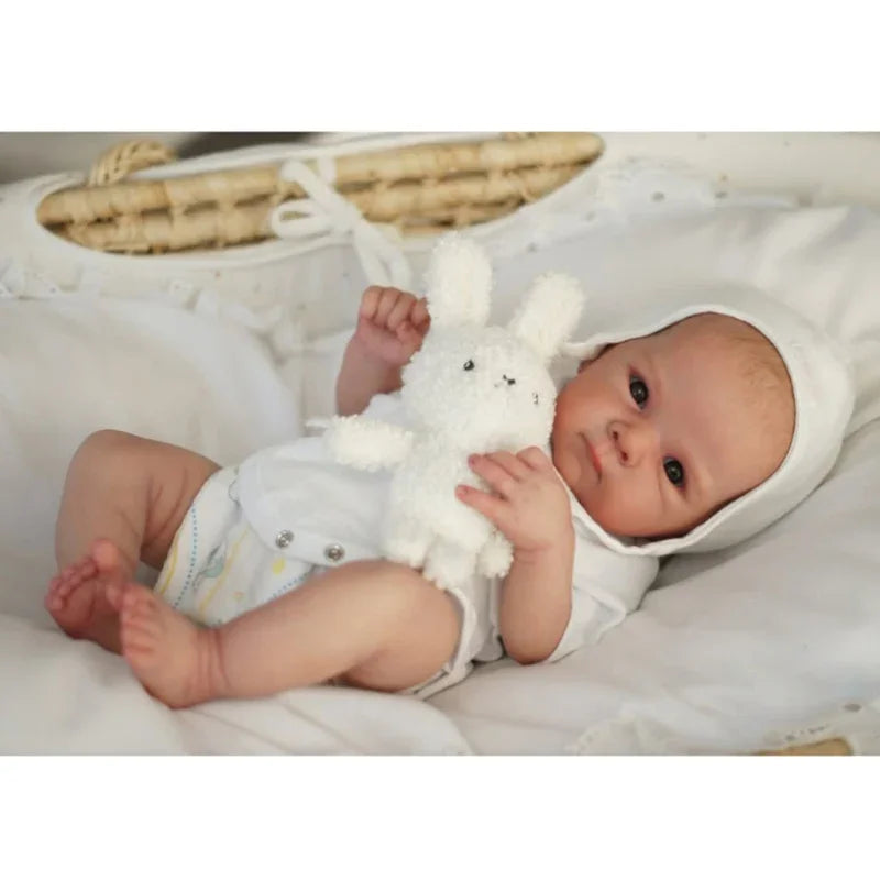 Stella awake reborn baby doll in white bonnet