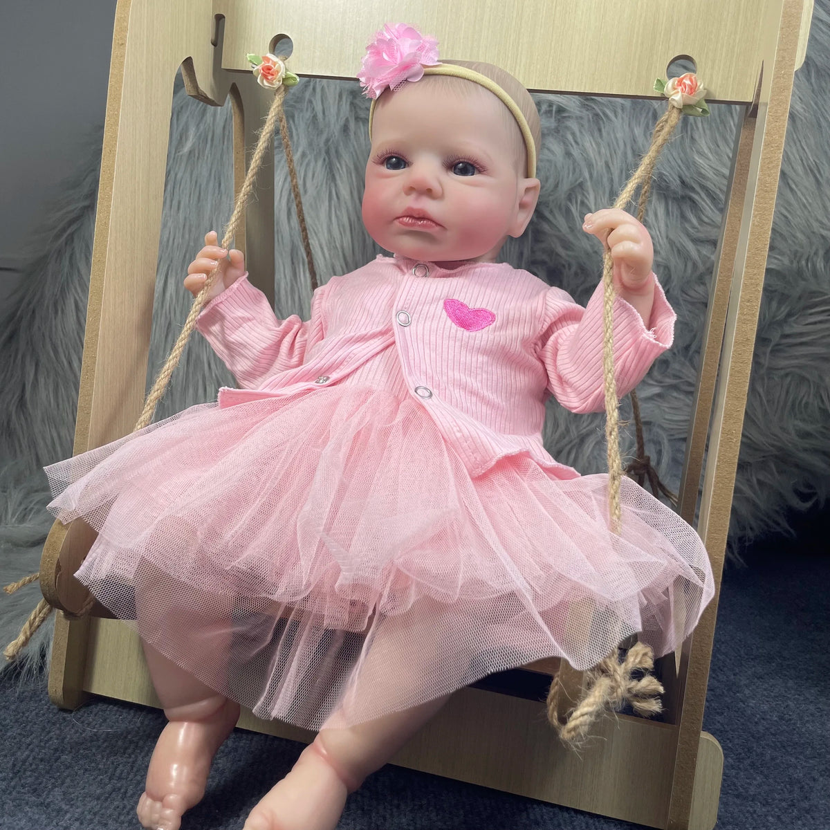 Aria reborn baby girl sitting on a swing (swing not included)