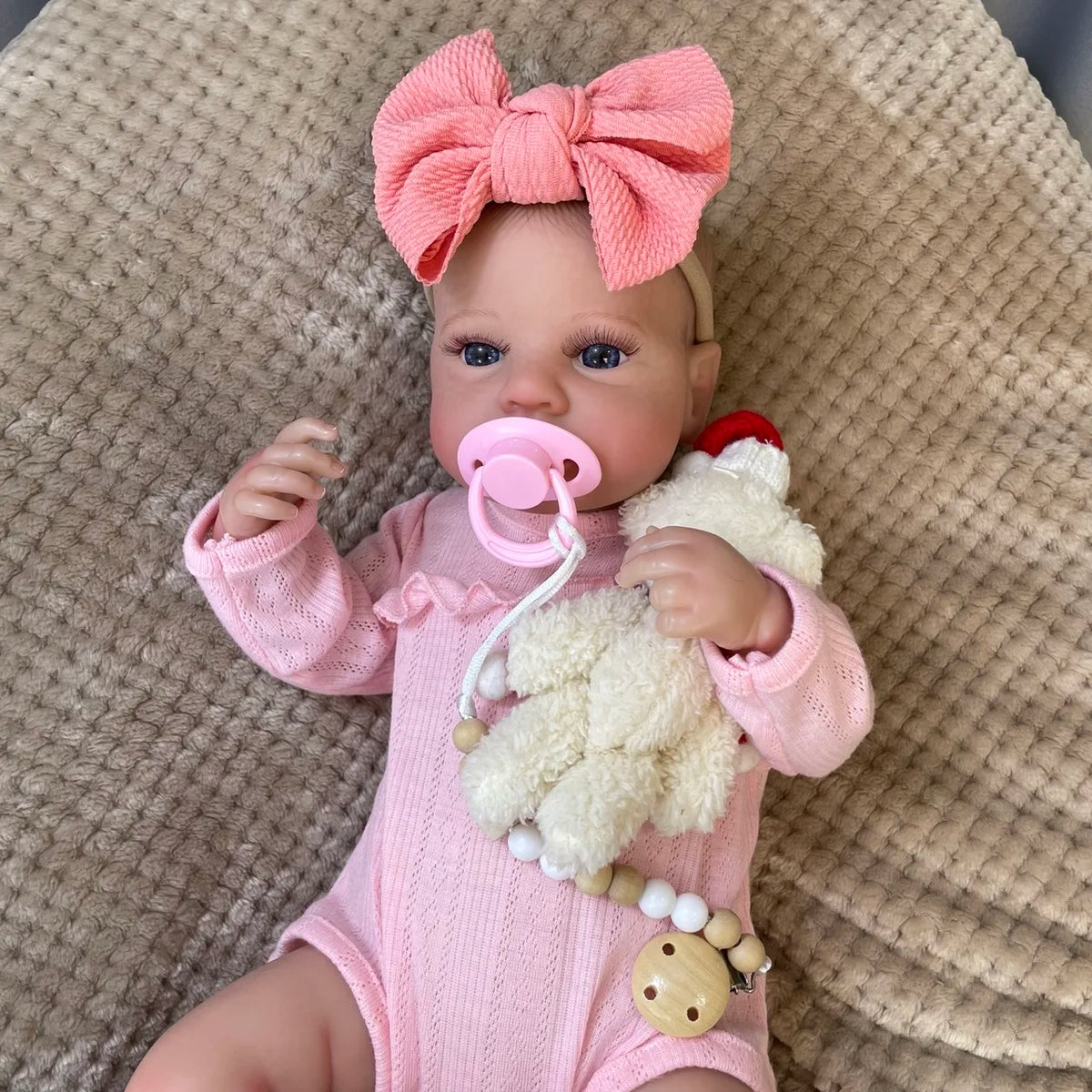 Daphne sitting up with her pacifier