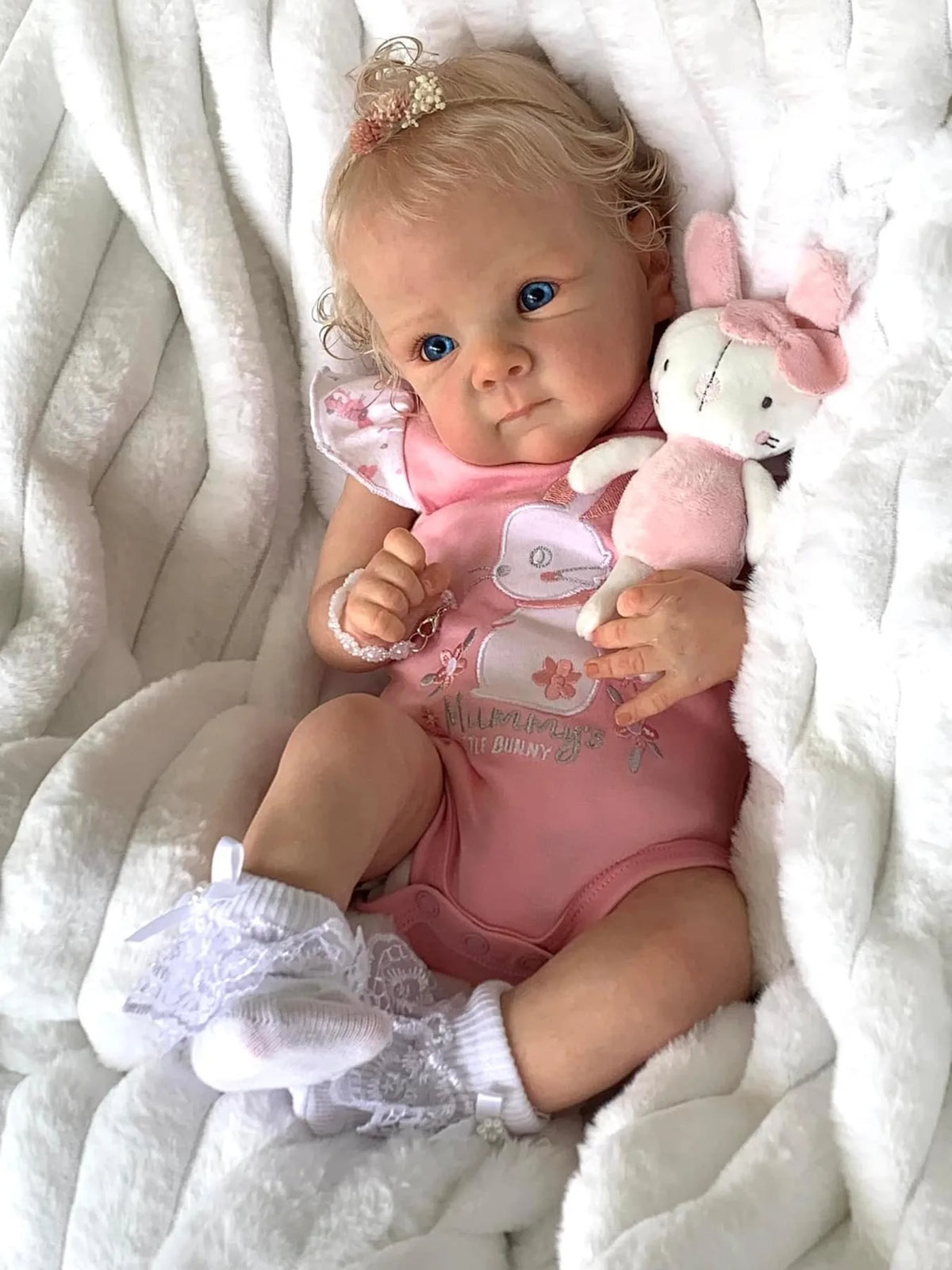 Sadie reborn doll in pink with ruffled white socks