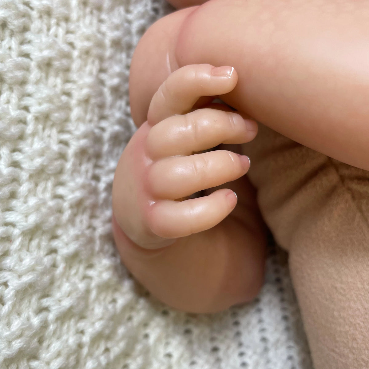 Close-up of Hallie's hand and detailed fingers